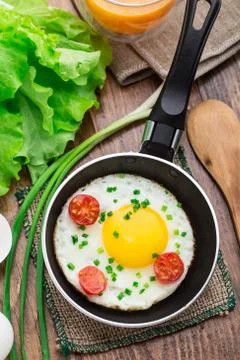 Fried egg in a small pan Stock Photos