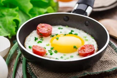 Fried egg in a small pan Stock Photos