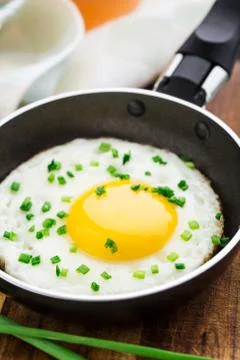 Fried egg in a small pan Stock Photos