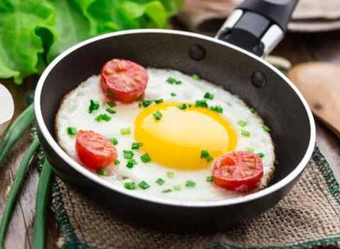 Fried egg in a small pan Stock Photos