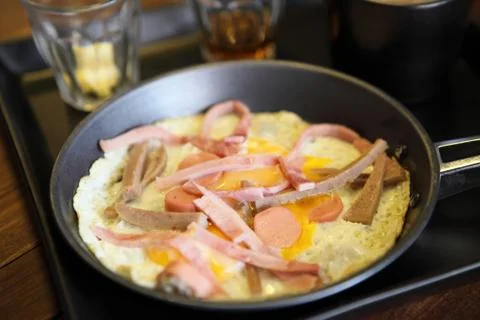 Fried egg stuff with hot pan Stock Photos