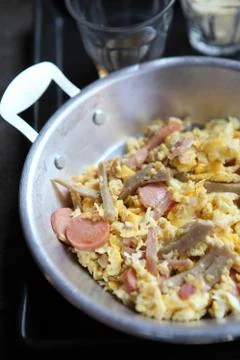 Fried egg stuff with hot pan Stock Photos