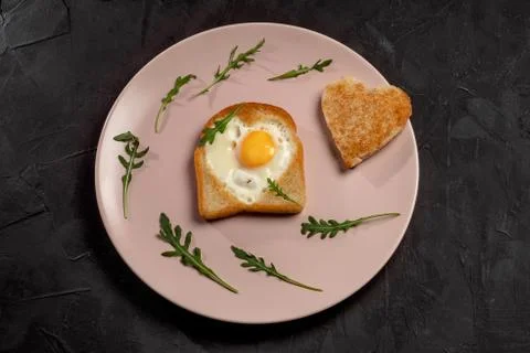 Fried egg on toast for breakfast Stock Photos