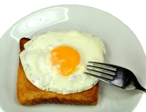 Fried egg on toast Stock Photos
