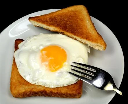 Fried egg with toast Stock Photos