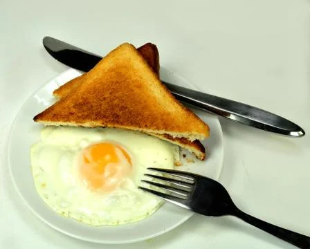 Fried egg with toast Stock Photos