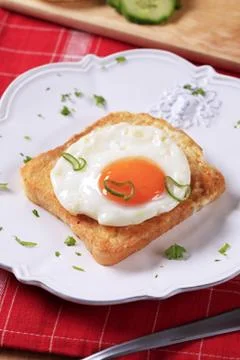 Fried egg on toast Stock Photos