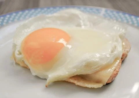 Fried egg on toast Stock Photos