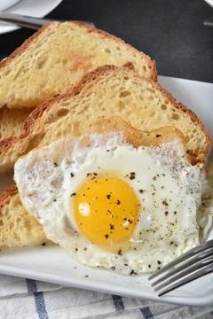 Fried egg on toast Stock Photos