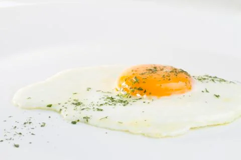 Fried egg on white background Stock Photos