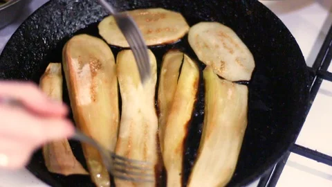 Fried eggplant cooked in a cast iron pan Stock Footage 94621201