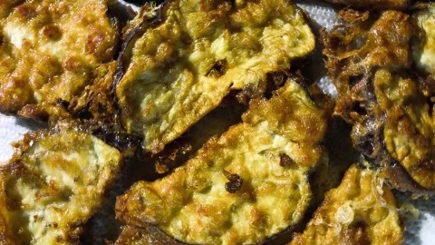 Fried eggplant dipped in egg , in door  Chiangmai  Thailand. Stock Footage 299872877