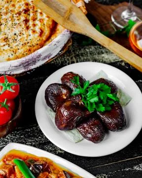 Fried eggplant with herbs on the table Stock Photos