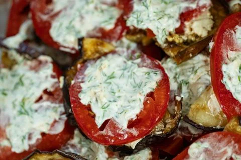 Fried eggplant roll appetizer with tomato and garlic sauce close up Stock Photos