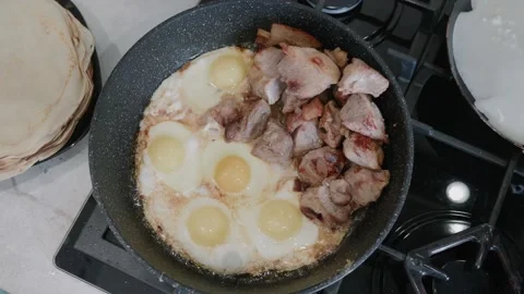 Fried eggs and bacon Stock Footage 150266915