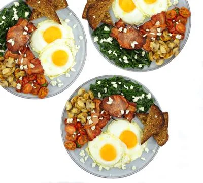 Fried eggs and bacon Stock Photos