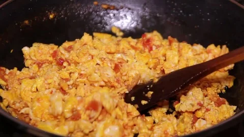 Fried Eggs And Tomatoes Mixing 2 Stock Footage 79495425