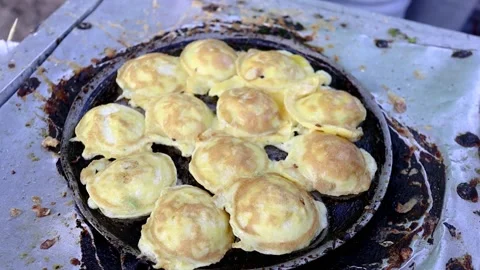Fried eggs are usually called (SD snacks in Indonesia) which have been shap.. Stock-Footage 229592595