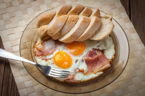 Fried eggs with bacon. Stock Photos