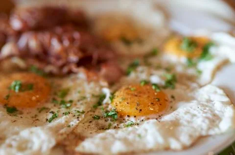 Fried eggs with bacon Stock Photos