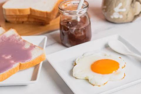 Fried eggs, bread, coffee, breakfast set Stock Photos