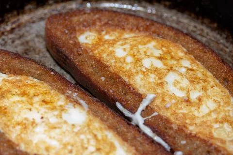 Fried eggs in bread crust on both sides Stock Photos