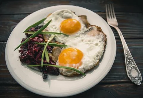 Fried eggs for breakfast in salo Stock Photos