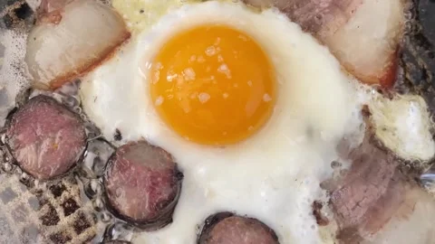 Fried eggs close-up with ham and lard Stock Footage 240098592