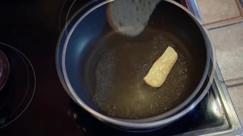 Fried eggs in the form of heart Stock Footage 74773340