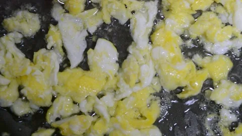 Fried eggs fried in a skillet Stock Footage 75169921