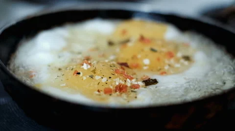 Fried eggs in a frying pan Stock Footage 64166129