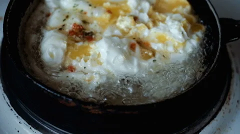 Fried eggs in a frying pan Stock Footage 64167513