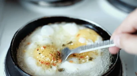 Fried eggs in a frying pan Stock Footage 64168385