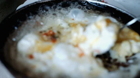 Fried eggs in a frying pan Stock Footage 64169195