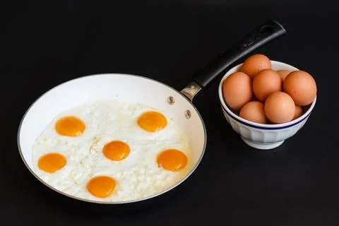 Fried eggs in frying pan 스톡 사진