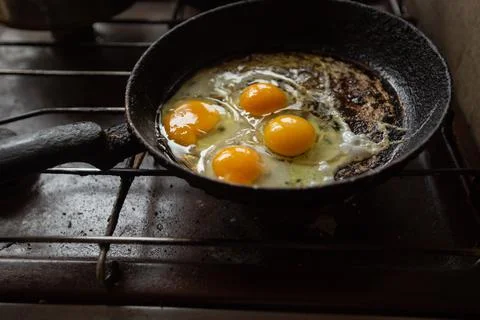 Fried eggs in a frying pan Stock Photos