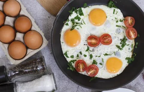 Fried eggs in a frying pan. Fotos Stock