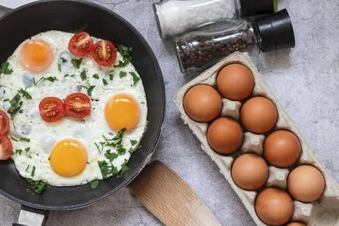Fried eggs in a frying pan. Fotos Stock