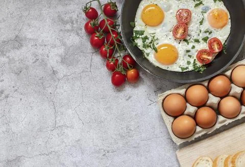 Fried eggs in a frying pan. Stock Photos