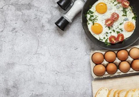Fried eggs in a frying pan. Stock Photos