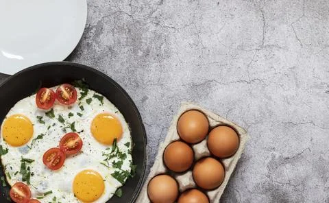 Fried eggs in a frying pan. Fotos Stock