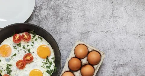 Fried eggs in a frying pan. Stock Photos