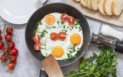 Fried eggs in a frying pan. Stock Photos