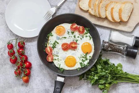 Fried eggs in a frying pan. Stock Photos