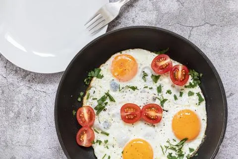 Fried eggs in a frying pan. Fotos Stock