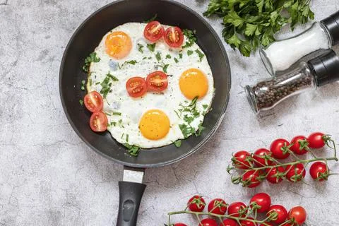 Fried eggs in a frying pan. Stock Photos