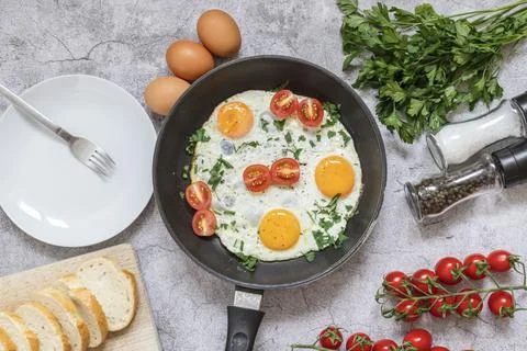 Fried eggs in a frying pan. Stock Photos