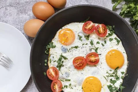Fried eggs in a frying pan. Fotos Stock