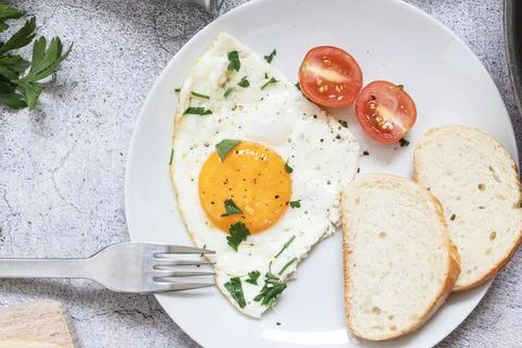 Fried eggs in a frying pan. Stock Photos