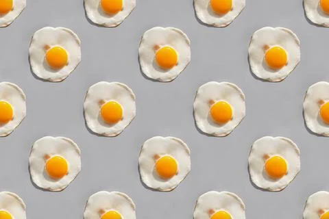 Fried eggs on gray background Stock Photos
